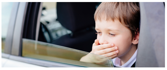 Picture of kid looking car sick