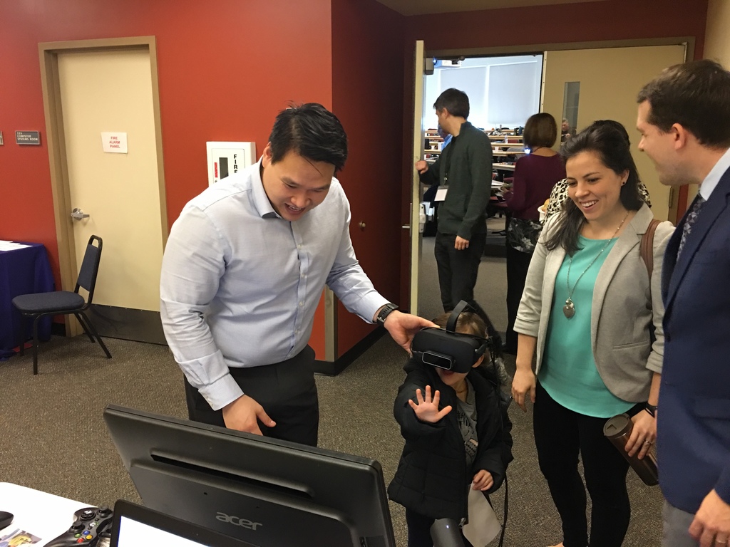 Dr. Tuan Tran showing off the Vivid Vision system at a conference.