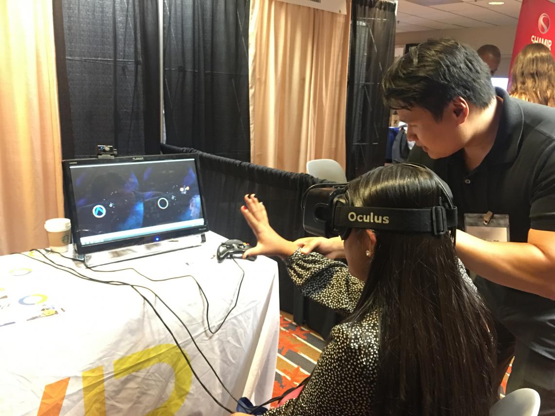 Dr. Tran performing demos the Colorado Optometry meeting 