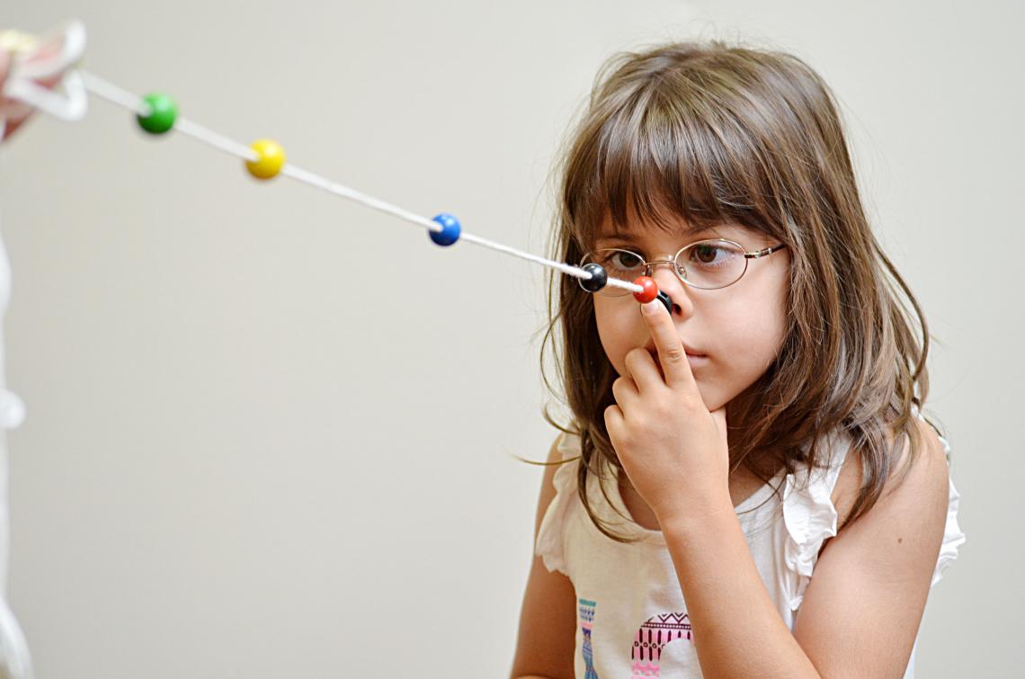 girl doing brock string vision therapy
